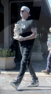 Rarely seen Red Hot Chili Peppers drummer Chad Smith, 63, grabs blended coffees to go as he enjoys a day out in Malibu