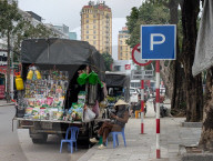 Mobile Street Vendor Selling Agricultural Supplies In Vietnam