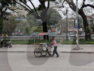 Street Vendor Selling Local Goods In Vietnam