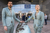 Environmental activists protest fossil fuel lobbying at the European Parliament