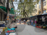 Bustling Street Market In Hanoi In A Residential Area