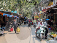 Bustling Street Market In Hanoi In A Residential Area