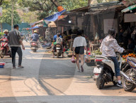 Bustling Street Market In Hanoi In A Residential Area