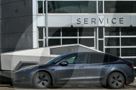 Protest Against Elon Musk At Edmonton Tesla Dealership