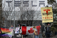 Protest Against Elon Musk At Edmonton Tesla Dealership