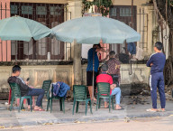 Sidewalk Barber In Vietnam
