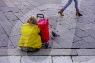 Shopper Sitting With Cart 