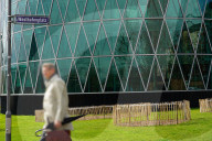 Businessman Walking At Westhafenplatz In Frankfurt