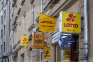 Storefront Signs For Lotto Bayern, DHL, And Reval In Munich