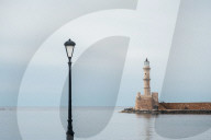 The Lighthouse Of The Old Venetian Harbour In Chania