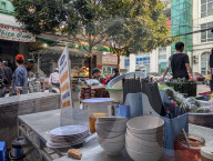 Street Food Stall Scene At Local Market In Vietnam