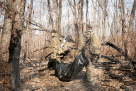 Ukrainian Volunteers Collect The Bodies Of Fallen Ukrainian And Russian Soldiers