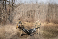 Ukrainian Volunteers Collect The Bodies Of Fallen Ukrainian And Russian Soldiers