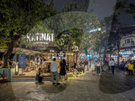 People At A Coffee And Tea House In Hanoi At Night