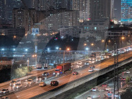 Nighttime Traffic Flows Along An Elevated Highway In Hanoi