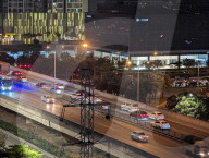 Nighttime Traffic Flows Along An Elevated Highway In Hanoi