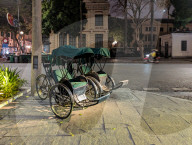 Traditional Cycle Rickshaws Parked On A Street In Central Hanoi