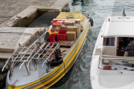 DHL Delivery Boat At A Pier In Venice