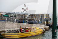 DHL Delivery Boat At A Pier In Venice