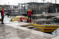 DHL Delivery Boat At A Pier In Venice