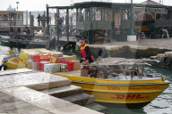 DHL Delivery Boat At A Pier In Venice