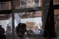 Activists Gather At NYC AIDS Memorial And March To Tesla Dealership For 38th Anniversary Of ACT UP To Protest DOGE Cuts