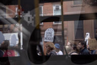 Activists Gather At NYC AIDS Memorial And March To Tesla Dealership For 38th Anniversary Of ACT UP To Protest DOGE Cuts