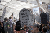 Activists Gather At NYC AIDS Memorial And March To Tesla Dealership For 38th Anniversary Of ACT UP To Protest DOGE Cuts