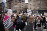 Activists Gather At NYC AIDS Memorial And March To Tesla Dealership For 38th Anniversary Of ACT UP To Protest DOGE Cuts
