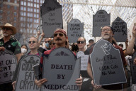 Activists Gather At NYC AIDS Memorial And March To Tesla Dealership For 38th Anniversary Of ACT UP To Protest DOGE Cuts
