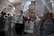 Activists Gather At NYC AIDS Memorial And March To Tesla Dealership For 38th Anniversary Of ACT UP To Protest DOGE Cuts
