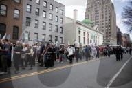 Activists Gather At NYC AIDS Memorial And March To Tesla Dealership For 38th Anniversary Of ACT UP To Protest DOGE Cuts