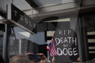 Activists Gather At NYC AIDS Memorial And March To Tesla Dealership For ‚ÄúTesla Takedown‚Äù Rally To Protest DOGE Cuts