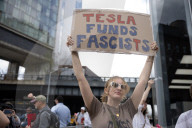 Activists Gather At NYC AIDS Memorial And March To Tesla Dealership For ‚ÄúTesla Takedown‚Äù Rally To Protest DOGE Cuts