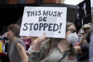Activists Gather At NYC AIDS Memorial And March To Tesla Dealership For ‚ÄúTesla Takedown‚Äù Rally To Protest DOGE Cuts