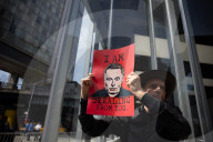 Activists Gather At NYC AIDS Memorial And March To Tesla Dealership For ‚ÄúTesla Takedown‚Äù Rally To Protest DOGE Cuts