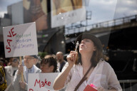 Activists Gather At NYC AIDS Memorial And March To Tesla Dealership For ‚ÄúTesla Takedown‚Äù Rally To Protest DOGE Cuts