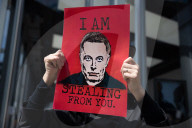 Activists Gather At NYC AIDS Memorial And March To Tesla Dealership For ‚ÄúTesla Takedown‚Äù Rally To Protest DOGE Cuts