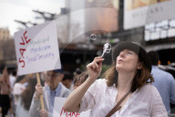 Activists Gather At NYC AIDS Memorial And March To Tesla Dealership For ‚ÄúTesla Takedown‚Äù Rally To Protest DOGE Cuts