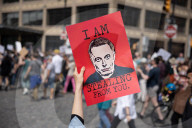 Activists Gather At NYC AIDS Memorial And March To Tesla Dealership For ‚ÄúTesla Takedown‚Äù Rally To Protest DOGE Cuts