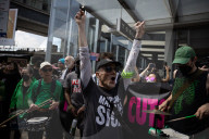 Activists Gather At NYC AIDS Memorial And March To Tesla Dealership For ‚ÄúTesla Takedown‚Äù Rally To Protest DOGE Cuts