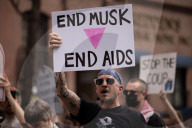 Activists Gather At NYC AIDS Memorial And March To Tesla Dealership For ‚ÄúTesla Takedown‚Äù Rally To Protest DOGE Cuts