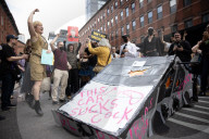 Activists Gather At NYC AIDS Memorial And March To Tesla Dealership For ‚ÄúTesla Takedown‚Äù Rally To Protest DOGE Cuts