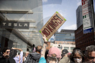 Activists Gather At NYC AIDS Memorial And March To Tesla Dealership For ‚ÄúTesla Takedown‚Äù Rally To Protest DOGE Cuts