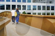 Young Couple Walking On A Bridge