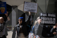 Protesters Demonstrate Outside Of Paul, Weiss Law Firm In NYC