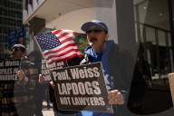 Protesters Demonstrate Outside Of Paul, Weiss Law Firm In NYC
