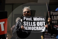 Protesters Demonstrate Outside Of Paul, Weiss Law Firm In NYC