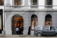 People Enter Louis Vuitton Store