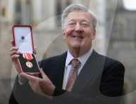 Sir Stephen Fry knighted